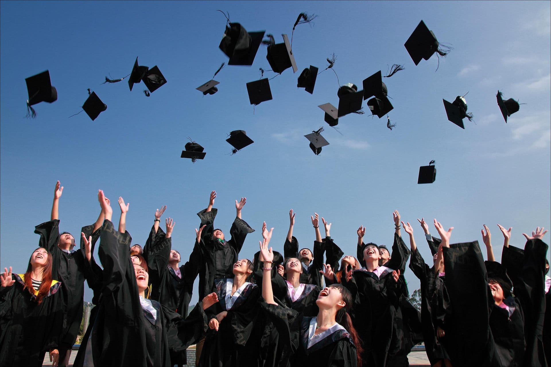 Graduates celebrating in an international education setting